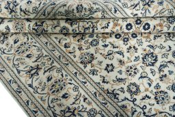 Close-up detail of 2000s Kashan rug from Iran / Persia showing Wool weave