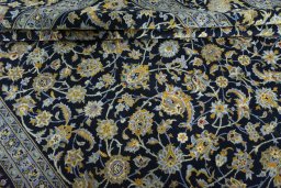 Close-up detail of 2000s Kashan rug from Iran / Persia showing Wool weave