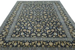Surface texture of 2000s Kashan rug with natural Wool and intricate pattern