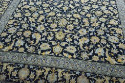 Close-up detail of 2000s Kashan rug from Iran / Persia showing Wool weave