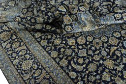 Surface texture of 2000s Kashan rug with natural Cork and intricate pattern