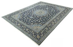Corner detail of 2000s Kashan rug showing border pattern and Cork pile