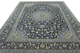 Surface texture of 2000s Kashan rug with natural Cork and intricate pattern