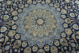 Central medallion detail of 2000s Kashan rug from Iran / Persia