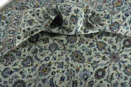 Surface texture of 2000s Kashan rug with natural Wool and intricate pattern