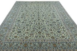 Surface texture of 2000s Kashan rug with natural Wool and intricate pattern