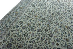 Backside of handmade 2000s Kashan rug showing knot structure and weave density