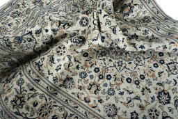 Surface texture of 2000s Kashan rug with natural Wool and intricate pattern
