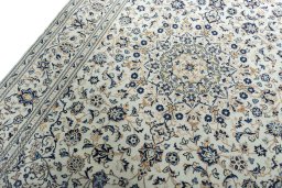 Backside of handmade 2000s Kashan rug showing knot structure and weave density
