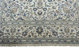 Full view of 2000s Kashan rug from Iran / Persia, 304 × 195 cm in Beige tones