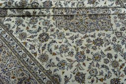 Close-up detail of 2000s Kashan rug from Iran / Persia showing Wool weave