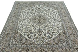 Surface texture of 2000s Kashan rug with natural Wool and intricate pattern