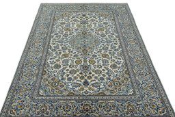 Surface texture of 2000s Kashan rug with natural Wool and intricate pattern