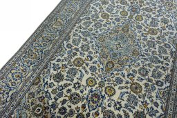 Backside of handmade 2000s Kashan rug showing knot structure and weave density