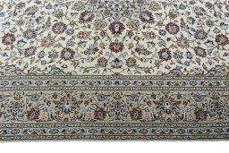 Corner detail of 2000s Kashan rug showing border pattern and Wool pile