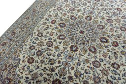 Backside of handmade 2000s Kashan rug showing knot structure and weave density