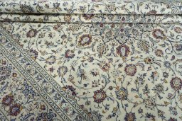 Close-up detail of 2000s Kashan rug from Iran / Persia showing Wool weave