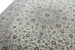 Backside of handmade 2000s Kashan rug showing knot structure and weave density