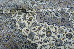 Close-up detail of 2000s Kashan rug from Iran / Persia showing Wool weave