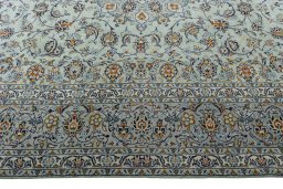 Corner detail of 2000s Kashan rug showing border pattern and Wool pile