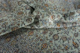 Surface texture of 2000s Kashan rug with natural Wool and intricate pattern