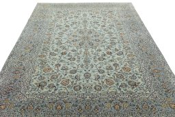 Surface texture of 2000s Kashan rug with natural Wool and intricate pattern
