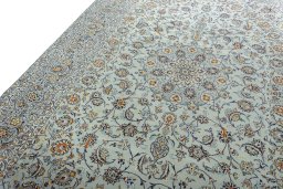 Backside of handmade 2000s Kashan rug showing knot structure and weave density