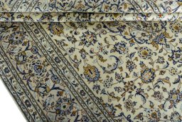 Close-up detail of 2000s Kashan rug from Iran / Persia showing Wool weave