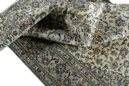 Surface texture of 2000s Kashan rug with natural Wool and intricate pattern