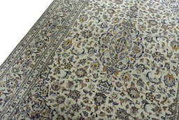 Backside of handmade 2000s Kashan rug showing knot structure and weave density