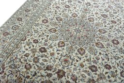 Backside of handmade 2000s Kashan rug showing knot structure and weave density