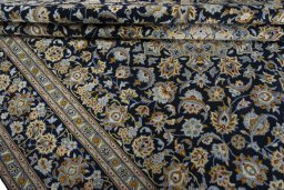 Close-up detail of 2000s Kashan rug from Iran / Persia showing Wool weave