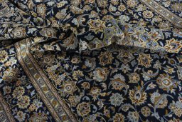 Surface texture of 2000s Kashan rug with natural Wool and intricate pattern