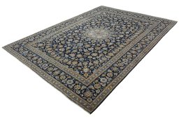 Corner detail of 2000s Kashan rug showing border pattern and Wool pile