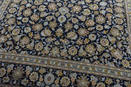 Close-up detail of 2000s Kashan rug from Iran / Persia showing Wool weave