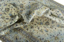 Surface texture of 2000s Kashan rug with natural Wool and intricate pattern