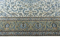 Corner detail of 2000s Kashan rug showing border pattern and Wool pile