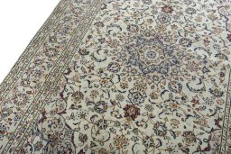 Backside of handmade 2000s Kashan rug showing knot structure and weave density