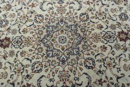 Central medallion detail of 2000s Kashan rug from Iran / Persia