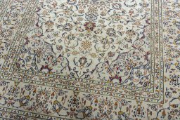 Close-up detail of 2000s Kashan rug from Iran / Persia showing Wool weave