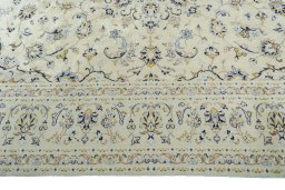 Corner detail of New Kashan rug showing border pattern and Wool pile