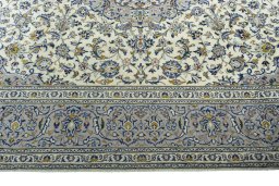 Corner detail of 2000s Kashan rug showing border pattern and Wool pile
