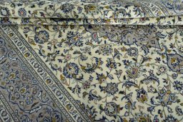 Close-up detail of 2000s Kashan rug from Iran / Persia showing Wool weave