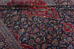 Close-up detail of 2000s Kashan rug from Iran / Persia showing Wool weave