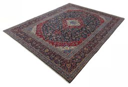 Corner detail of 2000s Kashan rug showing border pattern and Wool pile