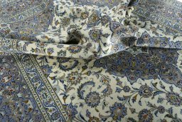 Surface texture of 2000s Kashan rug with natural Wool and intricate pattern