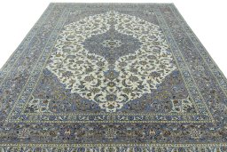 Surface texture of 2000s Kashan rug with natural Wool and intricate pattern