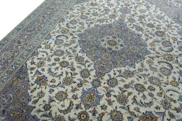 Backside of handmade 2000s Kashan rug showing knot structure and weave density