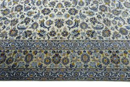Corner detail of 2000s Kashan rug showing border pattern and Wool pile
