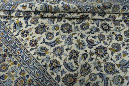 Close-up detail of 2000s Kashan rug from Iran / Persia showing Wool weave